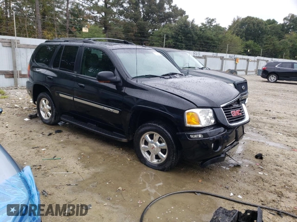 2004 GMC Envoy SLT with VIN 1GKDT13S942279670, listed as a Copart auction lot 73527974 with 120,425 mi miles and Salvage Title. Bid and sale history available at DreamBid. Image 4.