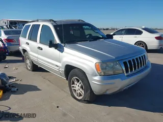 2004 Jeep Grand Cherokee Laredo with VIN 1J4GX48NX4C403936, listed as a IAAI auction lot 40855256 with 241,290 mi miles. Bid and sale history available at carsss.com. Image 1.