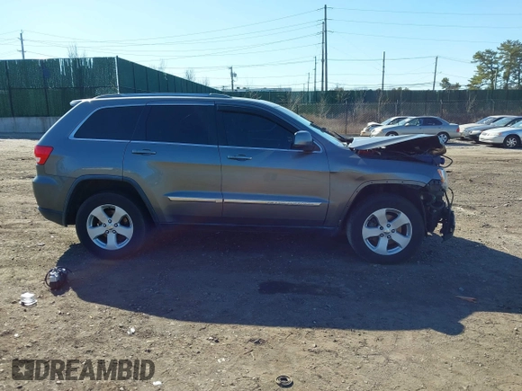 2012 Jeep Grand Cherokee Laredo with VIN 1C4RJFAG0CC145061, listed as a IAAI auction lot 41820140 with 185,015 mi miles. Bid and sale history available at carsss.com. Image 13.