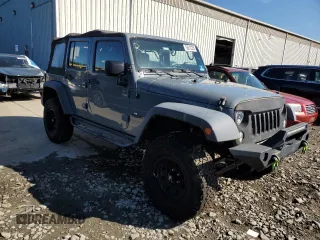 2015 Jeep Wrangler Unlimited Willys Wheeler with VIN 1C4BJWDG5FL609110, listed as a Copart auction lot 56013255 with 153,202 mi miles and Clean Title. Bid and sale history available at DreamBid. Image 4.