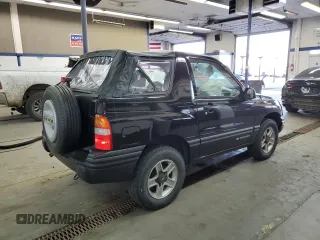 2002 Chevrolet Tracker with VIN 2CNBJ18CX26906088, listed as a Copart auction lot 79519944 with 111,342 mi miles and Salvage title. Bid and sale history available at DreamBid. Image 3.