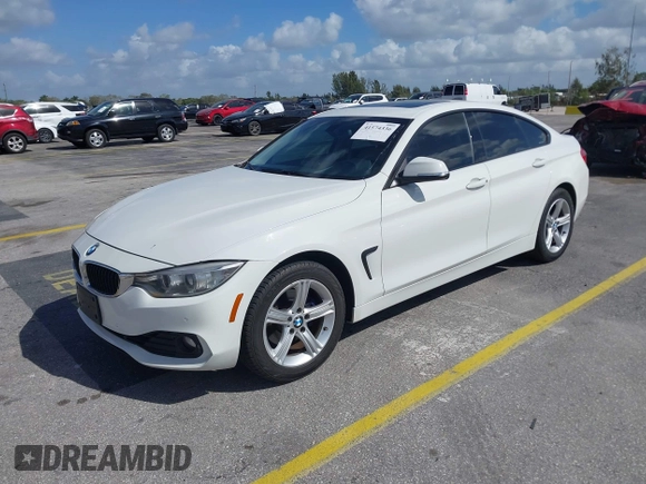 2015 BMW 4 Series 428i xDrive with VIN WBA4C9C56FG135520, listed as a IAAI auction lot 41574336 with 70,870 mi miles and . Bid and sale history available at carsss.com. Image 2.