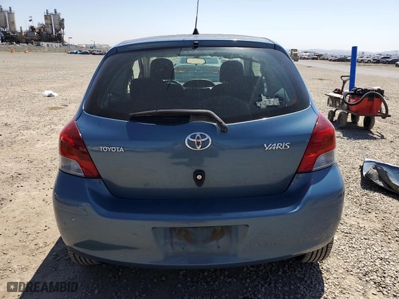 2009 Toyota Yaris with VIN JTDJT903995238147, listed as a Copart auction lot 52369925 with 124,921 mi miles and Salvage Title. Bid and sale history available at carsss.com. Image 6.