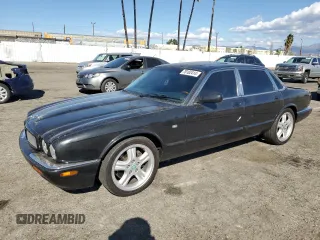 1998 Jaguar XJ with VIN SAJPX184XWC830453, listed as a Copart auction lot 78182414 with 183,896 mi miles and Salvage title. Bid and sale history available at DreamBid. Image 1.
