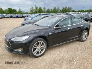 2014 Tesla Model S 60 with VIN 5YJSA1S1XEFP51455, listed as a Copart auction lot 51987754 with 85,083 mi miles and Salvage Title. Bid and sale history available at DreamBid. Image 1.