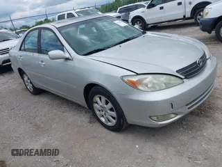 2003 Toyota Camry LE with VIN 4T1BE30K13U168509, listed as a IAAI auction lot 42220735 with 210,328 mi miles and . Bid and sale history available at DreamBid. Image 1.