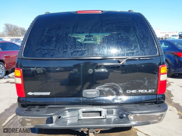 2003 Chevrolet Tahoe LS with VIN 1GNEC13V63R245581, listed as a IAAI auction lot 41599241 with 234,028 mi miles. Bid and sale history available at carsss.com. Image 6.