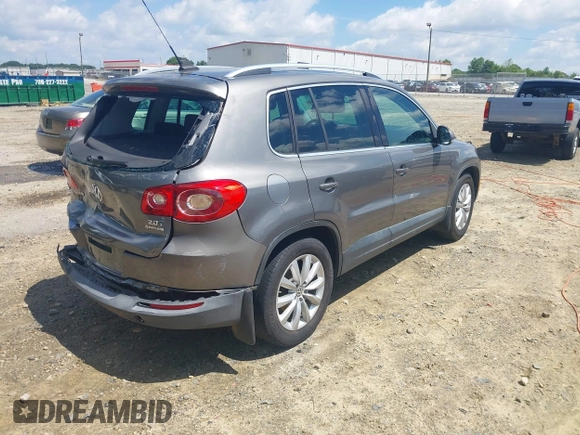 2011 Volkswagen Tiguan SEL z VIN WVGBV7AX5BW512203, wystawiony jako IAAI lot #42273838 z przebiegiem 157 072 mil mil oraz . Historia ofert i sprzedaży dostępna na DreamBid. Obrazek 4.