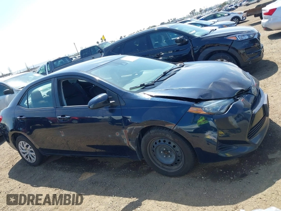 2019 Toyota Corolla L with VIN 2T1BURHE6KC185004, listed as a IAAI auction lot 42105629 with 111,907 mi miles. Bid and sale history available at carsss.com. Image 13.