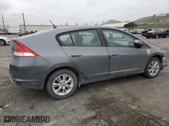 2010 Honda Insight EX with VIN JHMZE2H79AS017647, listed as a Copart auction lot 53311325 with 94,999 mi miles and Salvage Title. Bid and sale history available at DreamBid. Image 3.