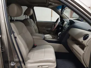 2011 Honda Pilot Touring with VIN 5FNYF4H92BB053458, listed as a IAAI auction lot 41594708 with 136,454 mi miles. Bid and sale history available at carsss.com. Image 5.