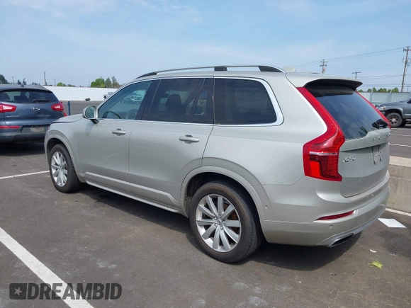 2016 Volvo XC90 T6 Momentum with VIN YV4A22PK7G1038750, listed as a IAAI auction lot 42128057 with 124,112 mi miles. Bid and sale history available at carsss.com. Image 3.