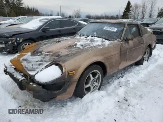 1979 Datsun 280ZX z VIN HS130137808, wystawiony jako Copart lot #43799165 z przebiegiem 28 995 mil mil oraz Tytuł czysty. Historia ofert i sprzedaży dostępna na DreamBid. Obrazek 1.