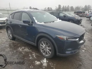 2021 Mazda CX-5 Grand Touring with VIN JM3KFBDM0M0391325, listed as a Copart auction lot 44863215 with 21,997 mi miles and Salvage Title. Bid and sale history available at DreamBid. Image 4.