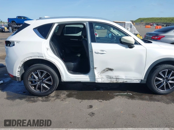 2017 Mazda CX-5 Grand Touring with VIN JM3KFADLXH0222341, listed as a IAAI auction lot 41990464 with 94,374 mi miles and . Bid and sale history available at carsss.com. Image 6.