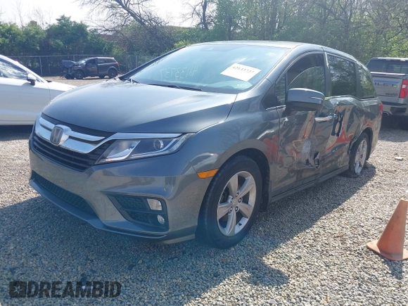 2018 Honda Odyssey EX-L z VIN 5FNRL6H77JB096733, wystawiony jako IAAI lot #42133737 z przebiegiem 165 069 mil mil oraz . Historia ofert i sprzedaży dostępna na DreamBid. Obrazek 19.