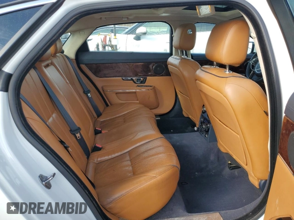 2015 Jaguar XJ Portfolio z VIN SAJWJ2GD5F8V77355, wystawiony jako Copart lot #47214835 z przebiegiem 73 202 mil mil oraz Szkoda całkowita • Salvage title. Historia ofert i sprzedaży dostępna na DreamBid. Obrazek 10.