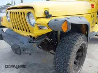 2002 Jeep Wrangler X z VIN 1J4FA39S82P719241, wystawiony jako IAAI lot #42150742 z przebiegiem 147 914 mil mil oraz . Historia ofert i sprzedaży dostępna na DreamBid. Obrazek 6.