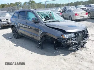 2018 Jeep Grand Cherokee Laredo E with VIN 1C4RJFAG3JC466623, listed as a IAAI auction lot 41697998 with 135,384 mi miles and . Bid and sale history available at DreamBid. Image 1.