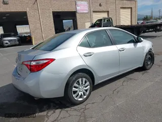 2016 Toyota Corolla L with VIN 5YFBURHE8GP543419, listed as a IAAI auction lot 41602003 with 121,048 mi miles. Bid and sale history available at carsss.com. Image 4.