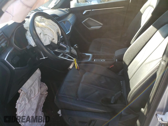 2019 Audi Q3 Premium with VIN WA1AECF35K1083330, listed as a Copart auction lot 87801965 with 0 mi miles and Salvage Title. Bid and sale history available at carsss.com. Image 7.