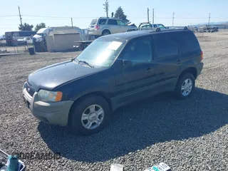 2003 Ford Escape XLT Popular 2 с VIN 1FMYU93113KC18744, выставлен на аукционе IAAI как лот 42027721 с пробегом 234 338 миль миль и . История ставок и продаж доступна на DreamBid. Изображение 2.