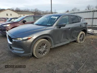 2021 Mazda CX-5 Touring z VIN JM3KFBCM3M0374231, wystawiony jako Copart lot #51070465 z przebiegiem 66 639 mil mil oraz Szkoda całkowita • Salvage title. Historia ofert i sprzedaży dostępna na DreamBid. Obrazek 1.