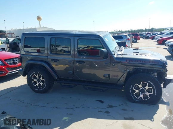 2020 Jeep Wrangler Unlimited Rubicon z VIN 1C4HJXFN0LW300344, wystawiony jako IAAI lot #41943662 z przebiegiem 59 051 mil mil oraz . Historia ofert i sprzedaży dostępna na DreamBid. Obrazek 13.