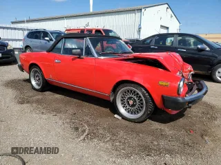 1979 FIAT 124 Spider z VIN 124CS20142625, wystawiony jako Copart lot #63245354 z przebiegiem 41 509 mil mil oraz Tytuł czysty. Historia ofert i sprzedaży dostępna na DreamBid. Obrazek 4.