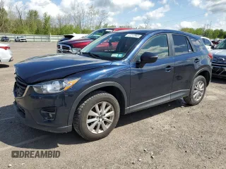 2016 Mazda CX-5 Touring z VIN JM3KE4CY4G0899689, wystawiony jako Copart lot #57212965 z przebiegiem 103 029 mil mil oraz Szkoda całkowita • Salvage title. Historia ofert i sprzedaży dostępna na DreamBid. Obrazek 1.