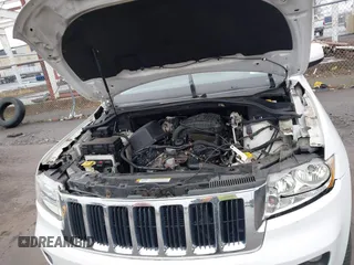 2013 Jeep Grand Cherokee Laredo with VIN 1C4RJFAG6DC557163, listed as a IAAI auction lot 42019052 with 125,058 mi miles. Bid and sale history available at carsss.com. Image 10.