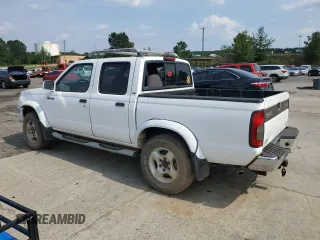 2000 Nissan Frontier XE with VIN 1N6ED27T1YC385792, listed as a Copart auction lot 62268225 with 291,906 mi miles and Salvage title. Bid and sale history available at DreamBid. Image 2.
