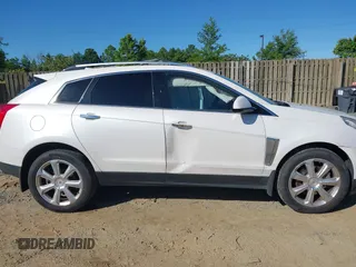 2013 Cadillac SRX Performance Collection with VIN 3GYFNHE31DS597987, listed as a IAAI auction lot 42319058 with 139,670 mi miles and . Bid and sale history available at DreamBid. Image 13.
