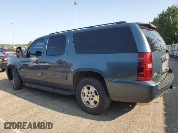 2010 Chevrolet Suburban LS z VIN 1GNUKHE32AR212268, wystawiony jako Copart lot #57613895 z przebiegiem 294 117 mil mil oraz Szkoda całkowita • Salvage title. Historia ofert i sprzedaży dostępna na DreamBid. Obrazek 2.