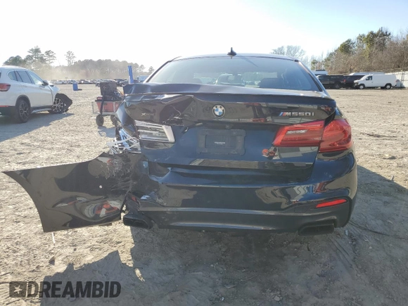 2020 BMW 5 Series M550i xDrive with VIN WBAJS7C0XLCE44248, listed as a Copart auction lot 48660045 with 73,949 mi miles and Salvage title. Bid and sale history available at DreamBid. Image 6.