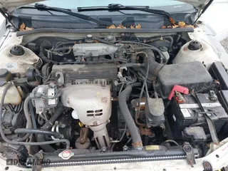 2000 Toyota Camry CE with VIN 4T1BG22K2YU976361, listed as a IAAI auction lot 38059387 with 153,541 mi miles. Bid and sale history available at carsss.com. Image 10.