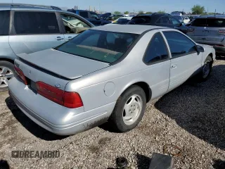 1997 Ford Thunderbird LX z VIN 1FALP62W2VH171912, wystawiony jako Copart lot #65073454 z przebiegiem 179 439 mil mil oraz Szkoda całkowita • Salvage title. Historia ofert i sprzedaży dostępna na DreamBid. Obrazek 3.