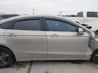 2016 Ford Fusion Titanium Hybrid with VIN 3FA6P0RU9GR143203, listed as a IAAI auction lot 41332144 with 94,357 mi miles. Bid and sale history available at carsss.com. Image 14.