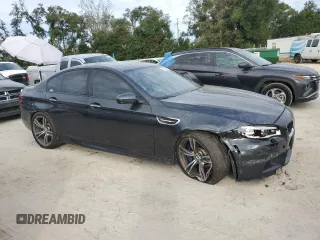 2016 BMW M5 z VIN WBSFV9C51GD595430, wystawiony jako Copart lot #79675834 z przebiegiem 82 351 mil mil oraz Szkoda całkowita • Salvage title. Historia ofert i sprzedaży dostępna na DreamBid. Obrazek 4.
