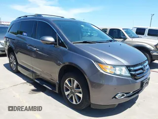 2015 Honda Odyssey Touring Elite z VIN 5FNRL5H99FB017517, wystawiony jako IAAI lot #42246066 z przebiegiem 104 878 mil mil oraz . Historia ofert i sprzedaży dostępna na DreamBid. Obrazek 1.