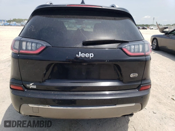 2019 Jeep Cherokee z VIN 1C4PJLJN0KD215834, wystawiony jako Copart lot #57652975 z przebiegiem 127 986 mil mil oraz Czysty tytuł • Clean title. Historia ofert i sprzedaży dostępna na DreamBid. Obrazek 6.