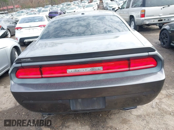 2014 Dodge Challenger R/T z VIN 2C3CDYBT7EH293104, wystawiony jako IAAI lot #41452435 z przebiegiem 49 728 mil mil oraz . Historia ofert i sprzedaży dostępna na DreamBid. Obrazek 16.