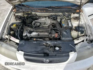 1998 Mazda Protege DX z VIN JM1BC1416W0194406, wystawiony jako Copart lot #44535955 z przebiegiem 312 942 mil mil oraz Szkoda całkowita • Salvage title. Historia ofert i sprzedaży dostępna na DreamBid. Obrazek 11.