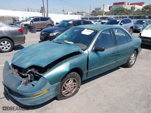 1998 Pontiac Sunfire SE with VIN 1G2JB5246W7538718, listed as a IAAI auction lot 41858046 with 54,433 mi miles. Bid and sale history available at carsss.com. Image 2.
