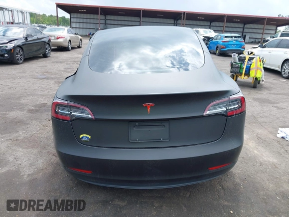 2022 Tesla Model 3 with VIN 5YJ3E1EA3NF287512, listed as a IAAI auction lot 42000557 with 77,619 mi miles. Bid and sale history available at carsss.com. Image 15.