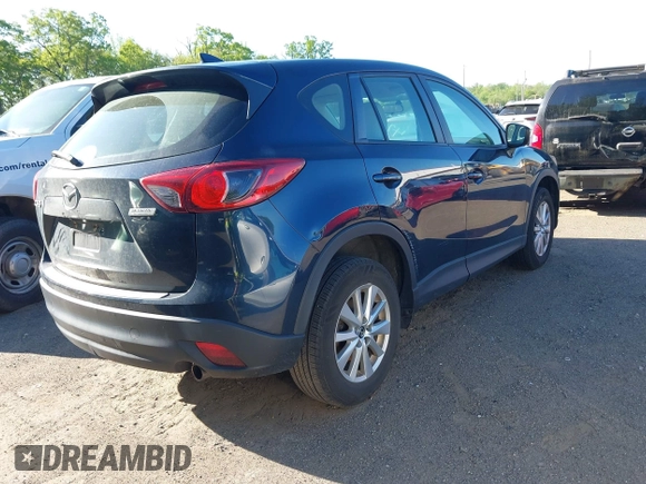 2016 Mazda CX-5 Sport with VIN JM3KE2BY3G0657904, listed as a IAAI auction lot 42127897 with 153,855 mi miles. Bid and sale history available at carsss.com. Image 4.