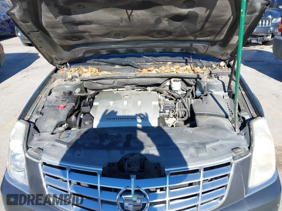 2009 Cadillac DTS 1SA z VIN 1G6KD57Y89U128646, wystawiony jako IAAI lot #40976417 z przebiegiem 167 346 mil mil oraz . Historia ofert i sprzedaży dostępna na DreamBid. Obrazek 10.