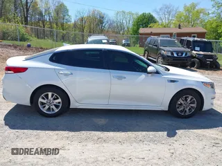 2016 Kia Optima LX z VIN 5XXGT4L3XGG080662, wystawiony jako IAAI lot #42048361 z przebiegiem 99 564 mil mil oraz . Historia ofert i sprzedaży dostępna na DreamBid. Obrazek 13.