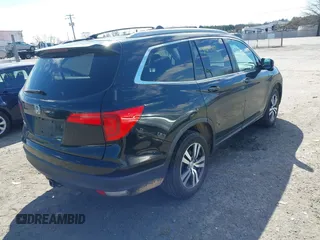 2016 Honda Pilot EX-L with VIN 5FNYF5H57GB023852, listed as a IAAI auction lot 41811412 with 151,707 mi miles and . Bid and sale history available at DreamBid. Image 4.
