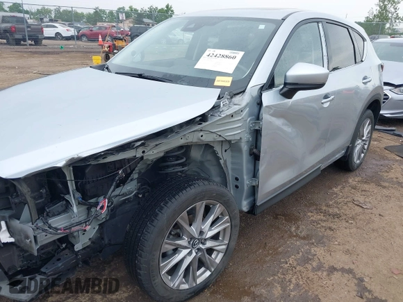 2021 Mazda CX-5 Grand Touring with VIN JM3KFBDM4M0371496, listed as a IAAI auction lot 42428860 with 113,735 mi miles and . Bid and sale history available at DreamBid. Image 6.